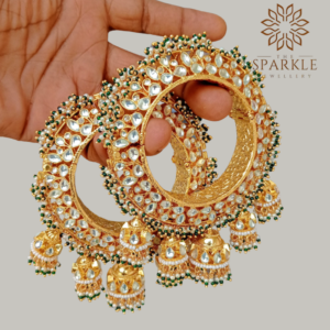 Openable Pachi Kundan jadau bangle pair with white kundan stones, green bead detailing and jhumka danglers in 22K gold plating by The Sparkle Jewellery