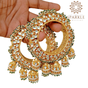 Openable Pachi Kundan jadau bangle pair with white kundan stones, green bead detailing and jhumka danglers in 22K gold plating by The Sparkle Jewellery