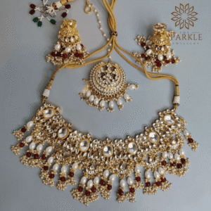 Pearl white and ruby red Jadau Pachi Kundan 22K gold plated necklace set with earrings and maangtikka by The Sparkle Jewellery