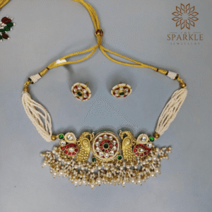 Red and emerald green Jadau kundan gold plated choker set with pearl drops and customisable colours by The Sparkle Jewellery