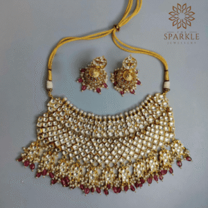 Ivory white Jadau Pachi Kundan gold plated bridal necklace set with ruby red drops and earrings by The Sparkle Jewellery