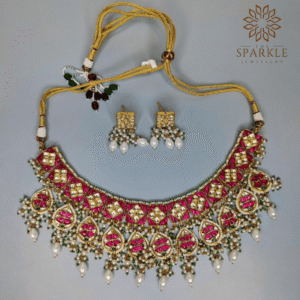 Hot pink and emerald green Jadau kundan gold plated necklace set with pearl drops and earrings by The Sparkle Jewellery