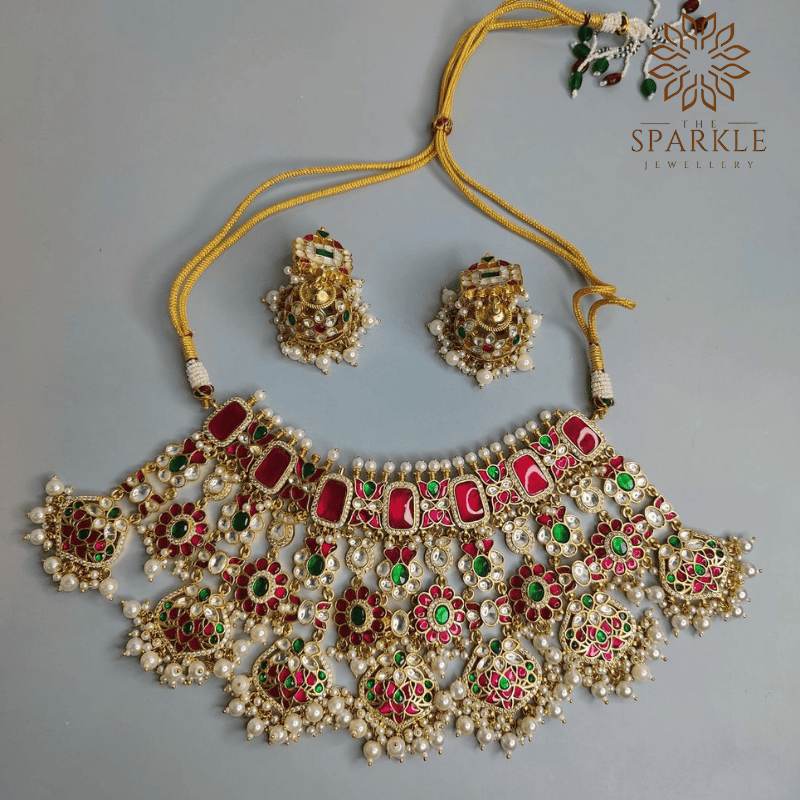 Ruby red and emerald green Jadau pachi kundan gold plated bridal necklace set with pearl drops by The Sparkle Jewellery