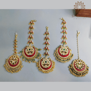 Ruby red and emerald green Jadau Pachi Kundan gold plated maangtikka with pearl drops by The Sparkle Jewellery