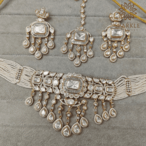 Polki and baguette stone choker set with earrings in ruby pink classic white and emerald green gold plated by The Sparkle Jewellery