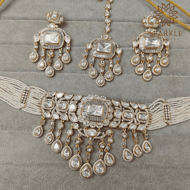 Polki and baguette stone choker set with earrings in ruby pink classic white and emerald green gold plated by The Sparkle Jewellery