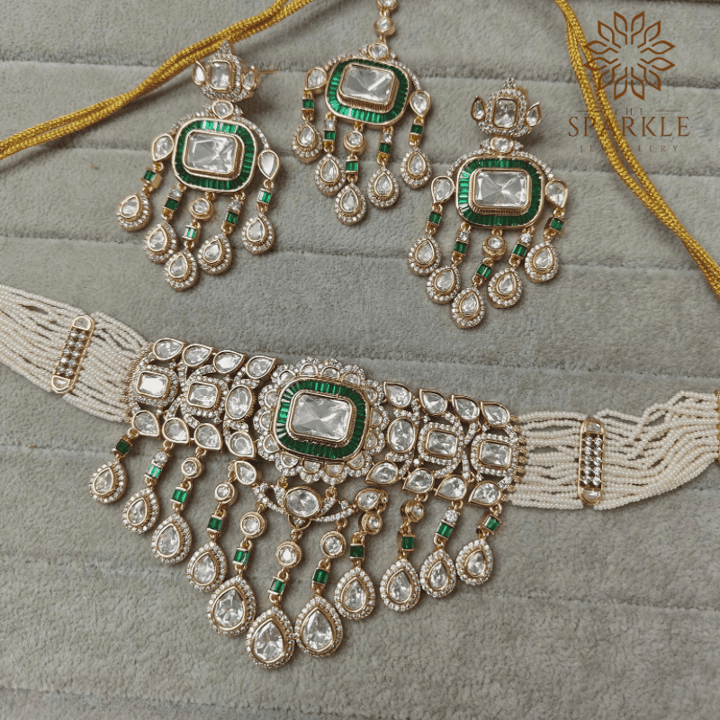 Polki and baguette stone choker set with earrings in ruby pink classic white and emerald green gold plated by The Sparkle Jewellery