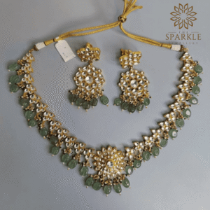 Mint green Jadau Pachi Kundan 22K gold plated necklace set with matching earrings by The Sparkle Jewellery