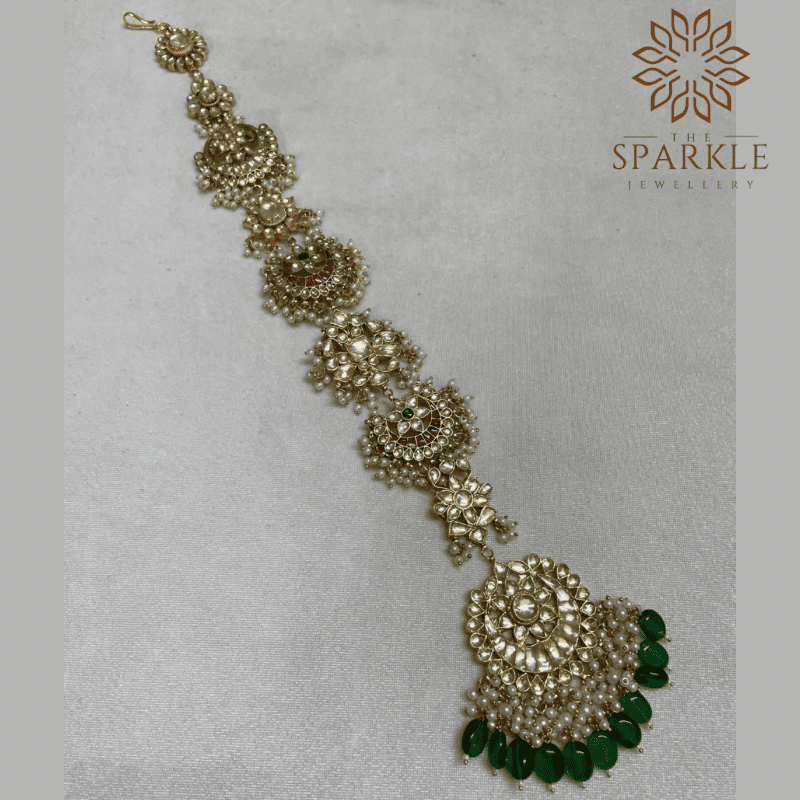 Emerald green drop Jadau Kundan 18K gold plated hair braid jewellery with white kundan stones and pearl detailing by The Sparkle Jewellery