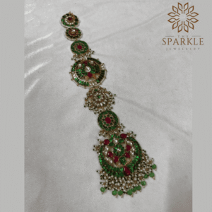 Jadau kundan 18K gold plated hair braid jewellery with emerald green stones ruby red accents and pearl bead drops by The Sparkle Jewellery
