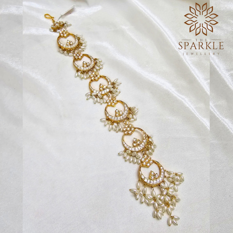 White pearl Jadau crescent passa with cascading pearl clusters in 22K gold plating by The Sparkle Jewellery