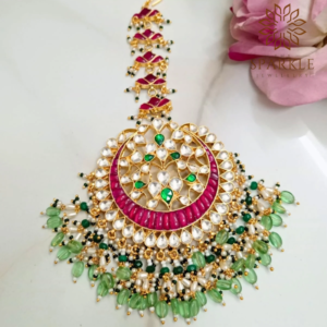 Mint green and pink Pachi Kundan maangtikka in 22K gold plated Jadau jewellery by The Sparkle Jewellery