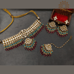 The Sparkle Jewellery multi color jadau kundan gold plated choker necklace set with earrings and maang tikka featuring pearl and dual tone bead detailing