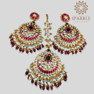 Oversized rani pink and emerald green pachi jadau kundan earrings and maang tikka set with wine bead drops 22k gold plated by The Sparkle Jewellery