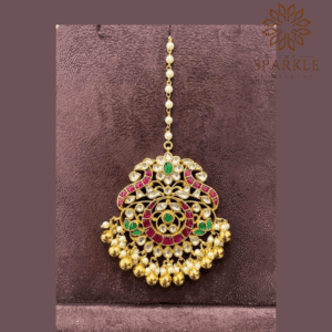 Rani pink emerald green pachi jadau kundan maang tikka with off white ivory kundan stones pearl clusters and antique gold ball drops 22k gold plated by The Sparkle Jewellery