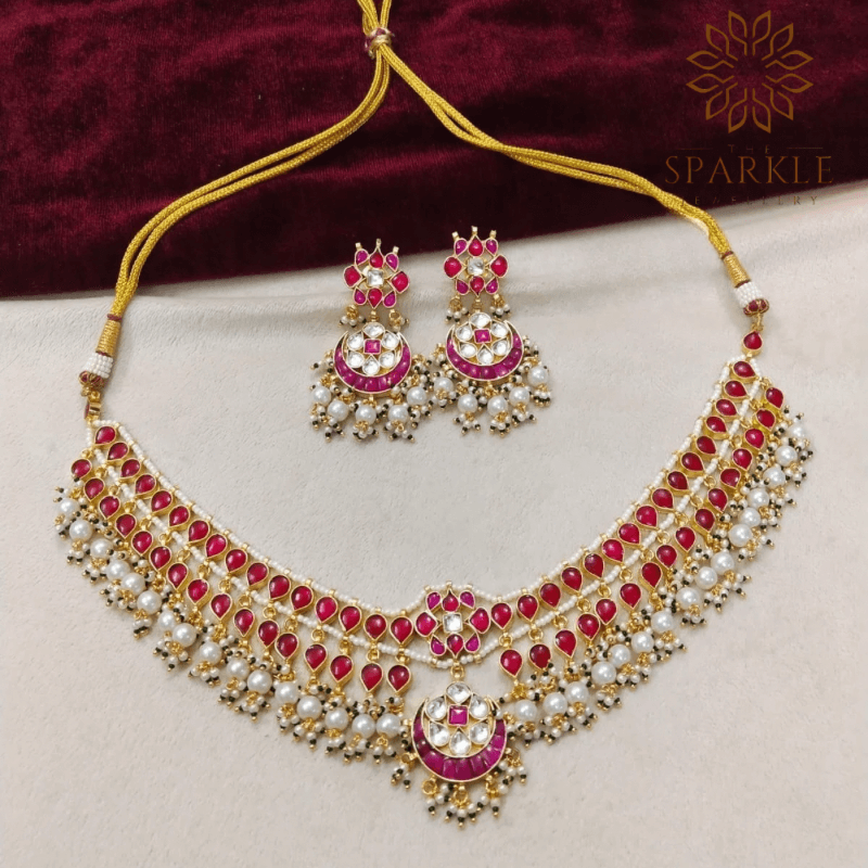 The Sparkle Jewellery ruby red jadau pachi kundan gold plated necklace set with pearl drops and matching earrings