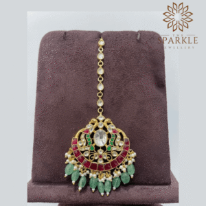 Ruby red mint green pachi jadau kundan maang tikka with off white ivory kundan stones pearl cluster detailing 22k gold plated jewellery by The Sparkle Jewellery