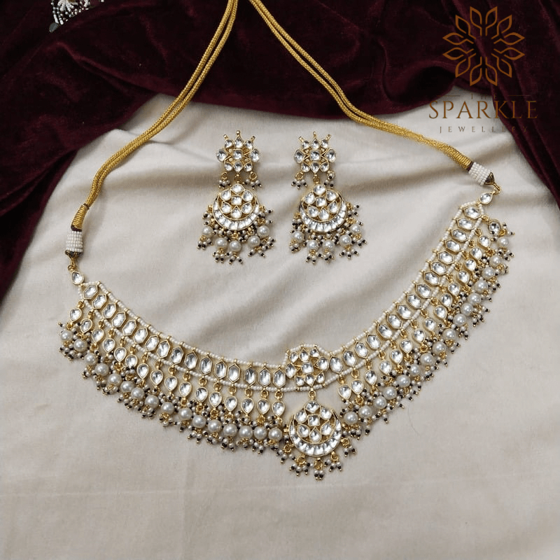 The Sparkle Jewellery white jadau pachi kundan gold plated necklace set with pearl drops and matching earrings