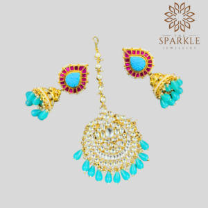 White Pachi Kundan jhumka earrings and maangtikka set with aqua blue drops and pink detailing in 22K gold plated Jadau jewellery by The Sparkle Jewellery