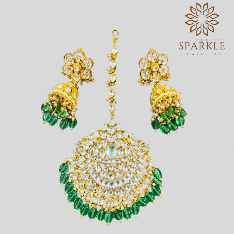 White Pachi Kundan jhumka earrings and maangtikka set with green drops in 22K gold plated Jadau jewellery by The Sparkle Jewellery
