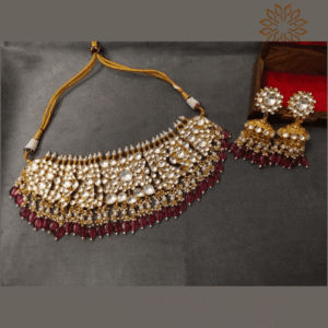 The Sparkle Jewellery wine red drop jadau pachi kundan gold plated choker necklace set with matching jhumka earrings