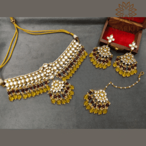 The Sparkle Jewellery yellow beads jadau kundan gold plated choker necklace set with earrings and maang tikka featuring pearl and wine accent detailing