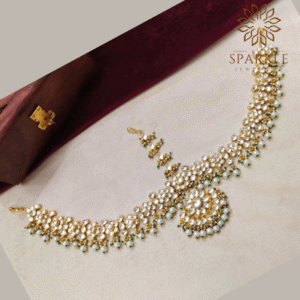 The Sparkle Jewellery jadau kundan gold plated mathapatti hair accessory with pearl clusters and green bead drops