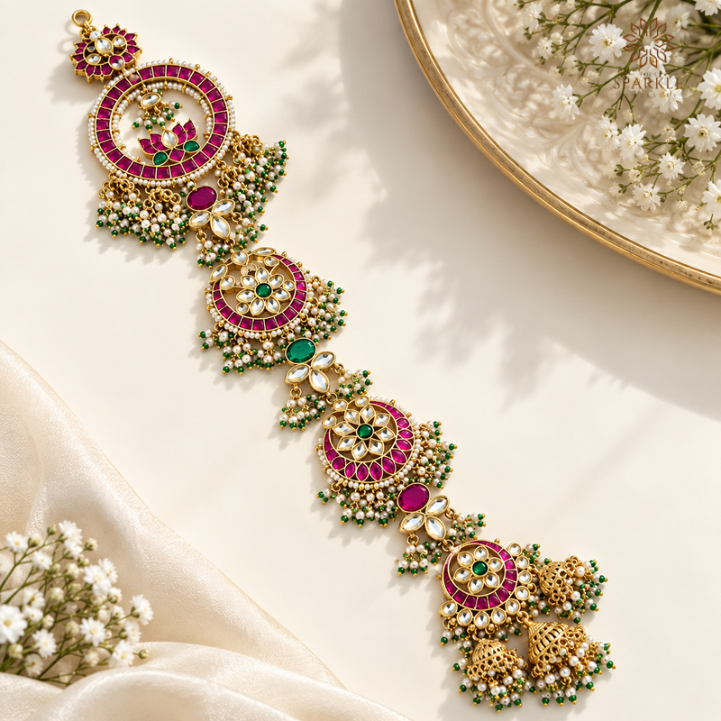 Jadau Kundan bridal hair braid with pink and green stones, pearl accents, and gold-plated detailing.